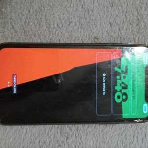 iPhone 11 Pro max, charger and cube and black phone case, screen protector